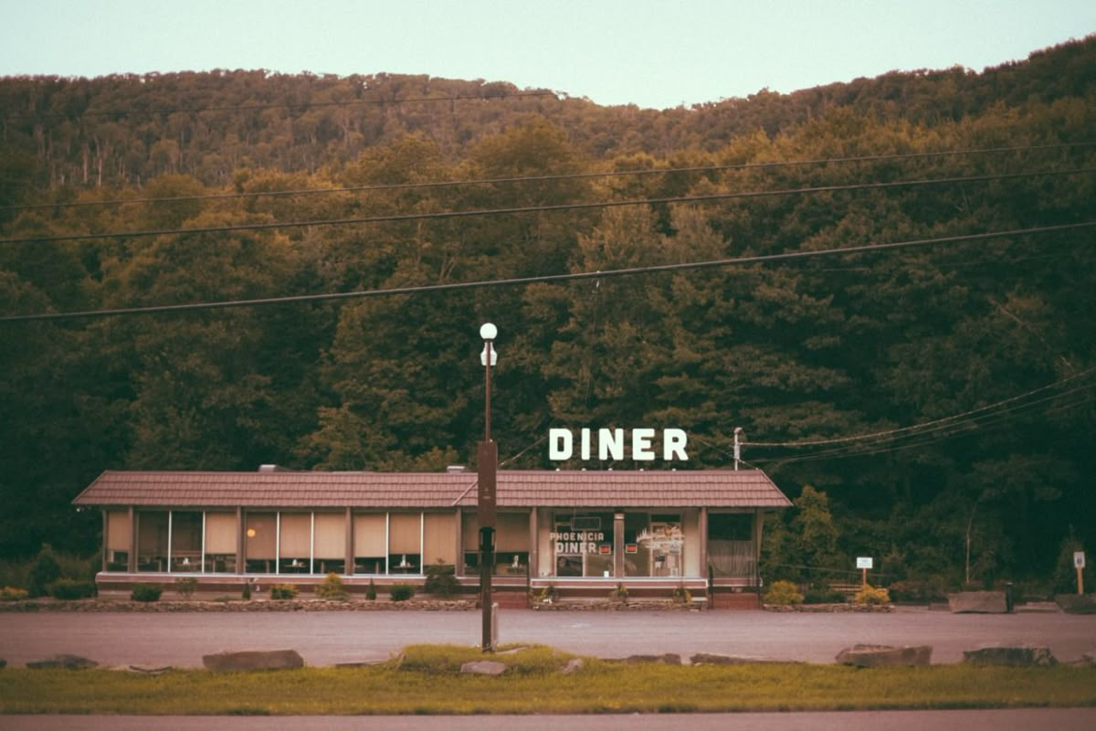 Diner by a mountain during daytime