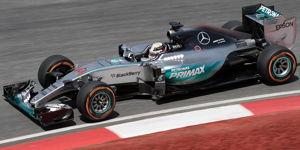 A photo of the 2015 Mercedes F1 car (the Mercedes F1 W06 Hybrid) being driven by Lewis Hamilton at the 2015 Malaysian Grand Prix