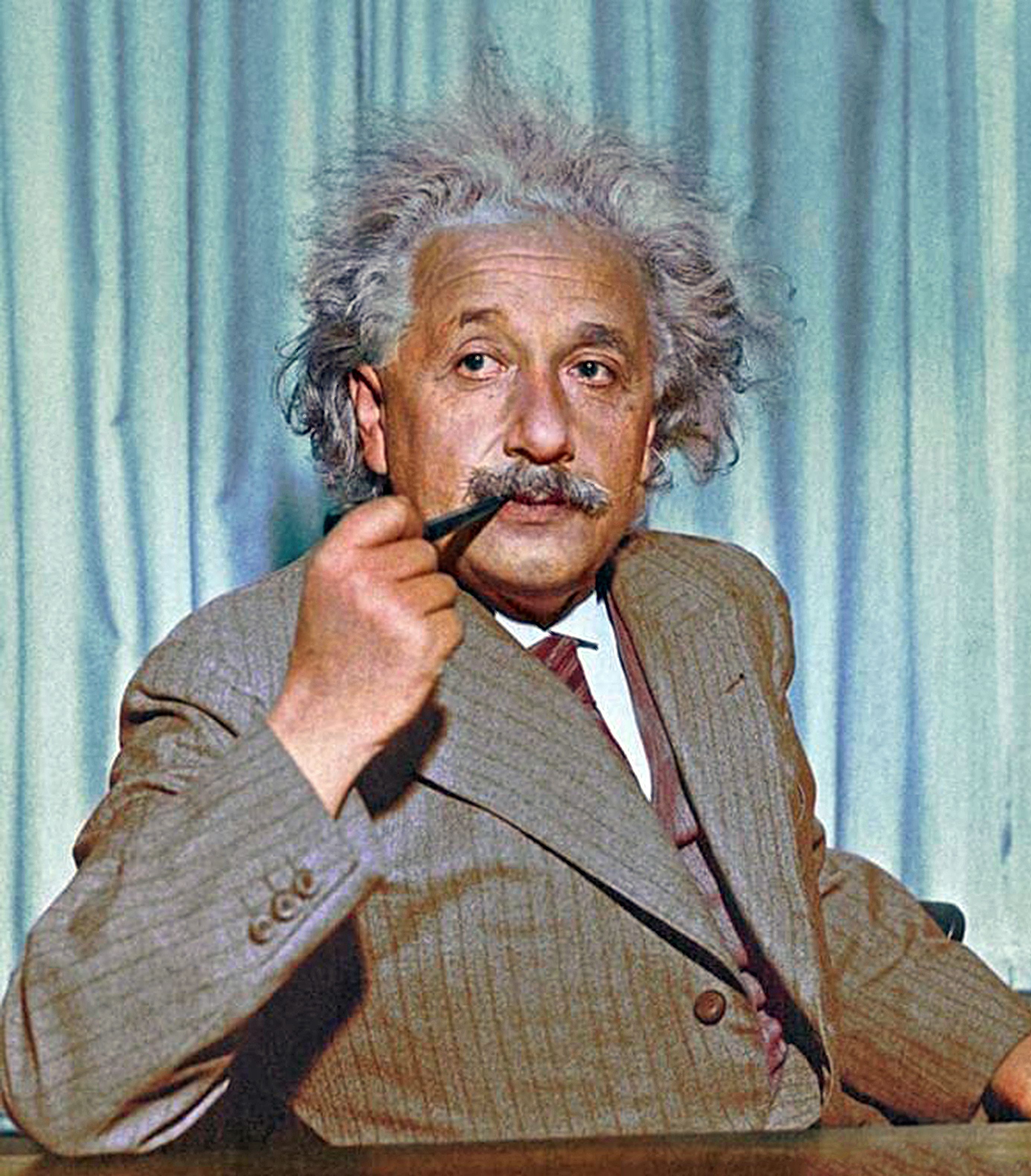 coloured picture of Albert Einstein with an unlit smoking pipe